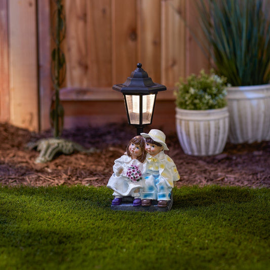 Couple With Solar Street Light Statue 